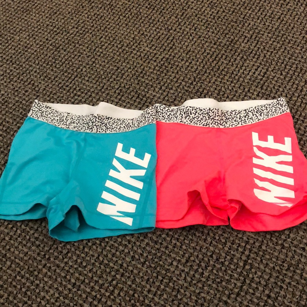 Blue and Pink Nike Pros